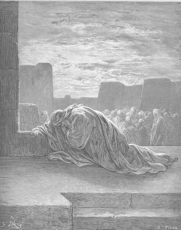 Robed figure in the foreground kneeling in prayer; people in the background watching