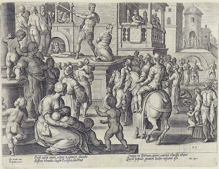 Man with sword raised to cut off a man's head while a large crowd watches