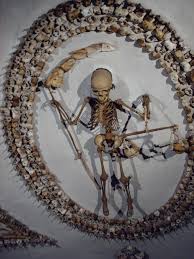 monks' bones used
to create a grim reaper on the wall of a church in Rome