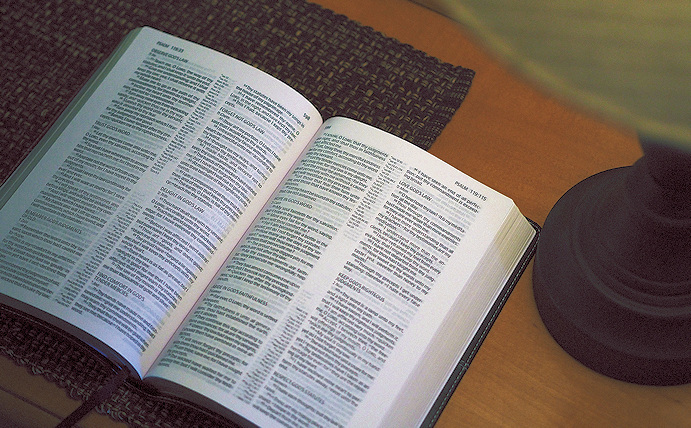 Bible on a table opened to the book of Psalms