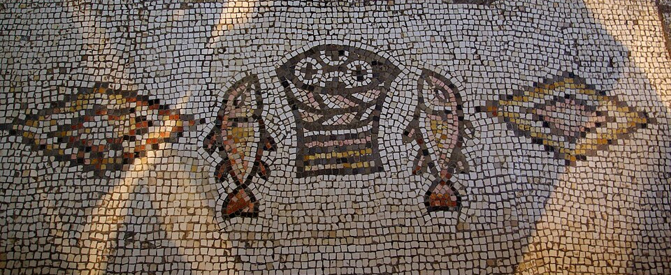 Floor mosaic depicting basket of bread and two fish