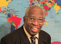 headshot of
Virgil Amos in front of worldmap