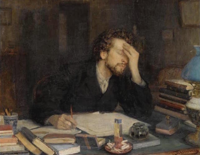 A man deep in thought about what he is writing