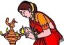 lady from India holding lit clay
lamp