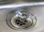 photo of water swirling down a drain